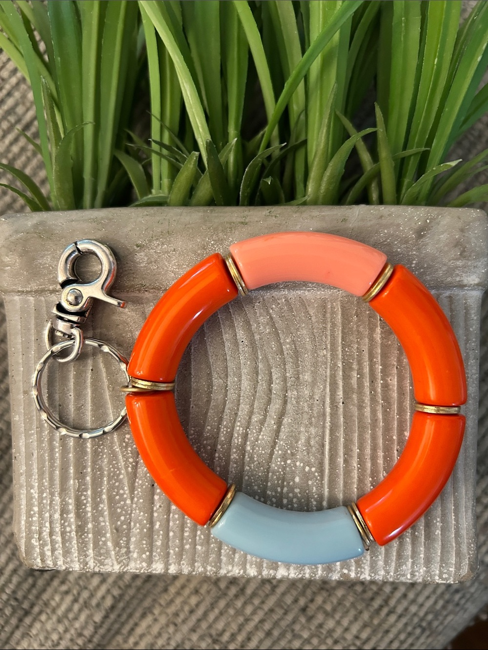 colorblock Plunder GiGi stretch bracelet and Keychain orange blue and goldtone